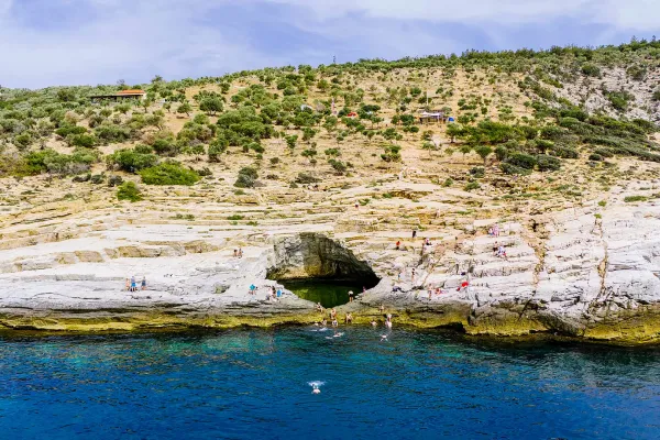 wide-view-of-giola-lagoon-in-thassos-nestled-among-rocky-cliffs-and-surrounded-by-lush-green-vegetationCEE12D01-4E2E-83C0-6133-67CD45F8D957.webp